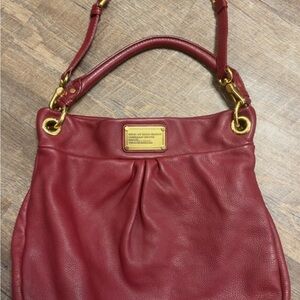 Marc Jacob’s Burgundy purse with hand strap and shoulder strap